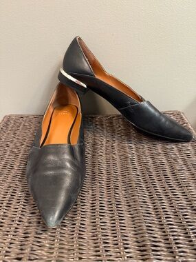 H by Halston Black Pointed-Toe Leather Flats with Silver Heel Accent